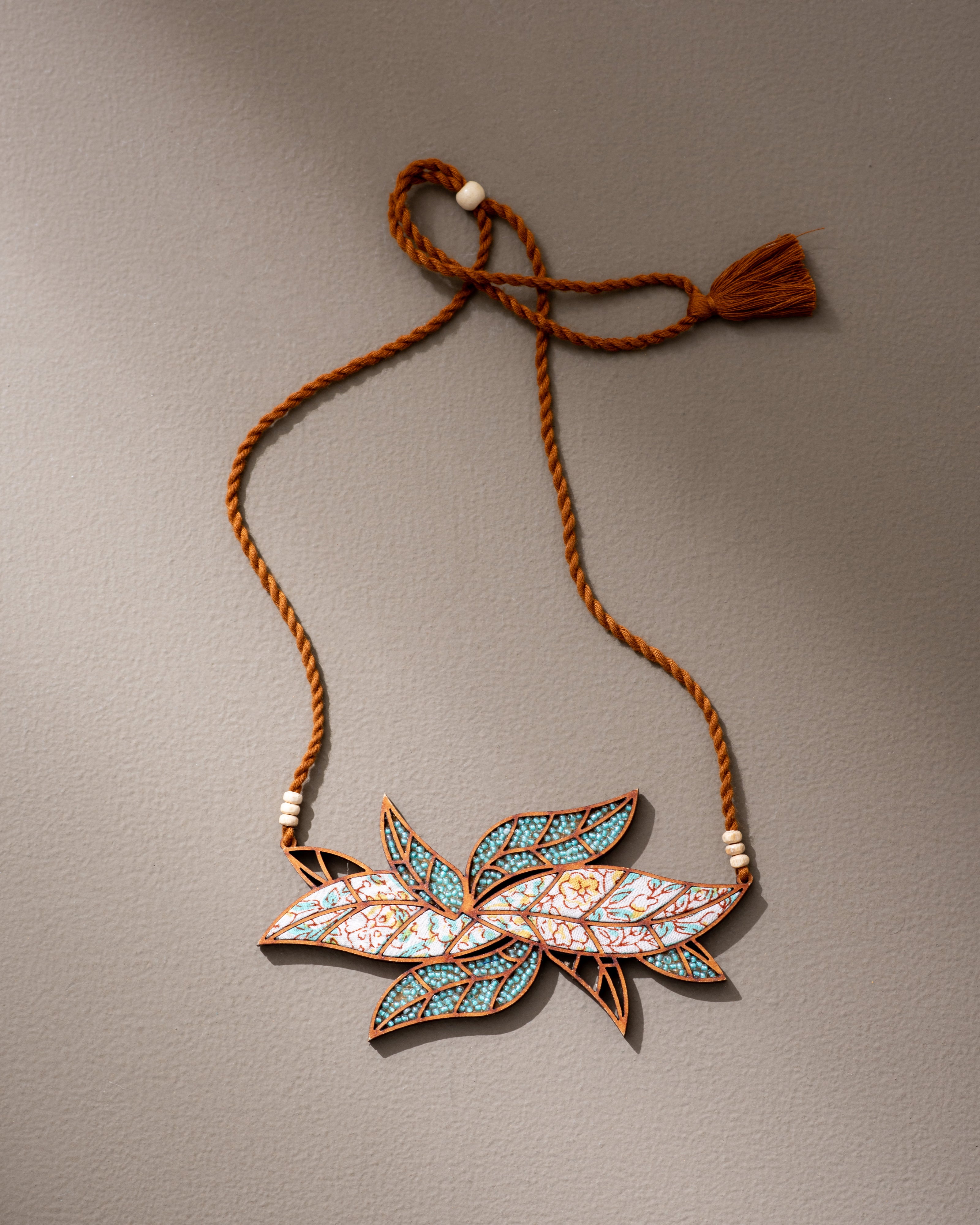 WHE Turquoise White Bloom Leaf Motif Repurposed Fabric and Wood Necklace