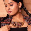 Women wearing upcycled fabric necklace